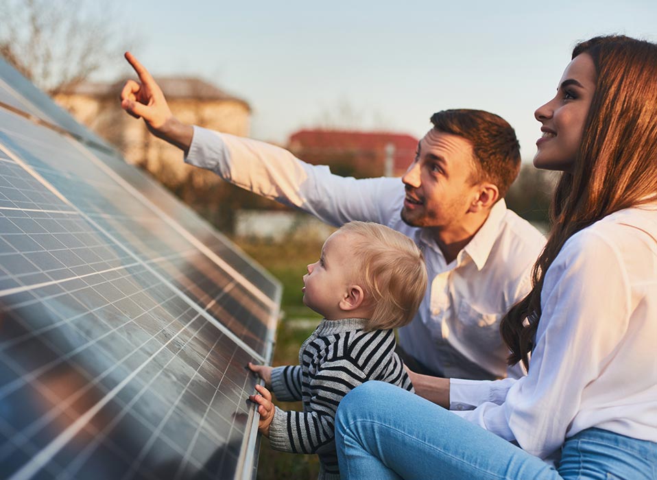 parents showing child new solar panels